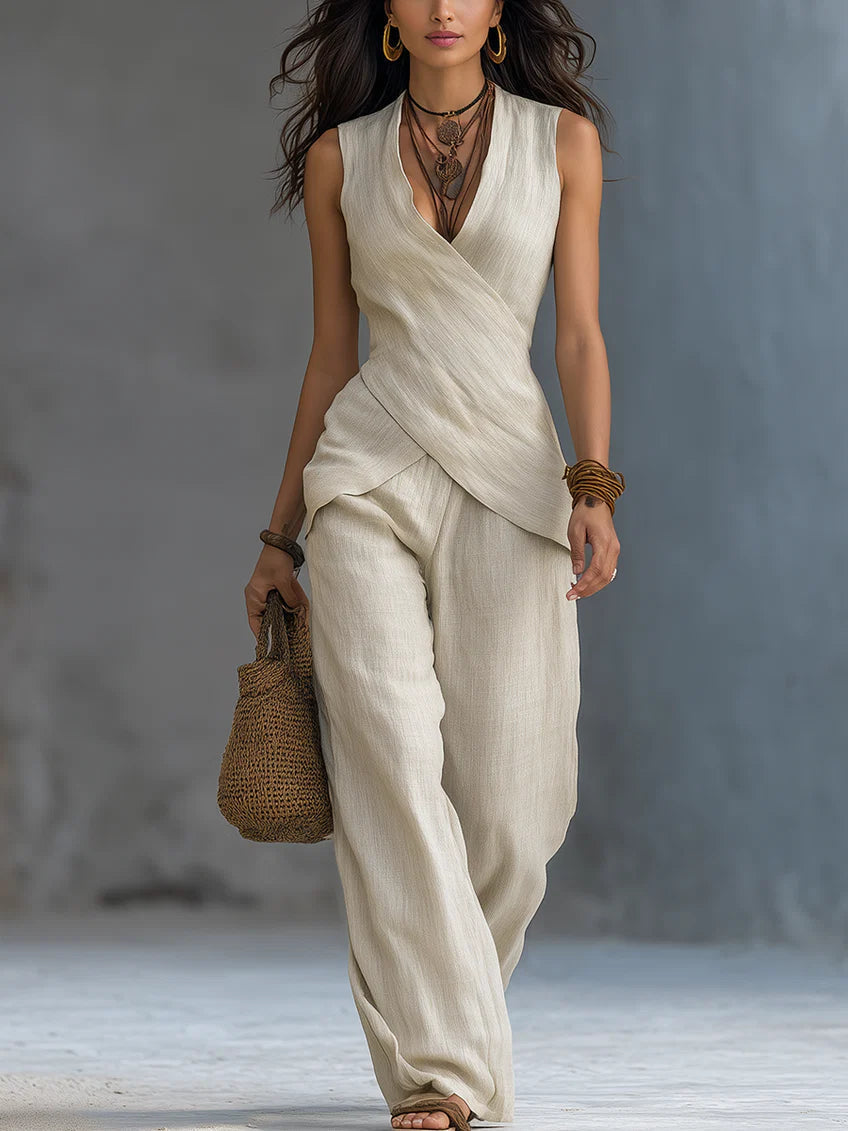 Women's complete outfit in cotton and linen consisting of a top with a crossover pattern and wide-leg trousers.